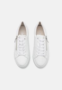 White leather sneakers featuring a textured finish, round toe, lace-up design, and a side zipper for easy wear.