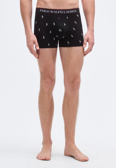 Svarte bokserbriefs laget av bomull, med en linning merket "POLO RALPH LAUREN" og et gjentatt mønster av små hvite ponni-logoer.