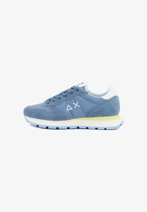 Blue suede and fabric sneaker with white geometric logos on side, white heel tab, yellow midsole strip, and light blue outsole.