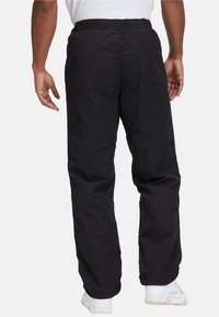 Fila LUGANO - Pantalones deportivos - black
