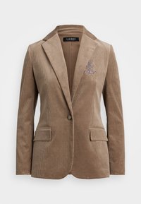 Blazer in corduroy marrone con rever a punta, due tasche frontali, chiusura a singolo bottone e un'accents ricamato decorativo sul petto.