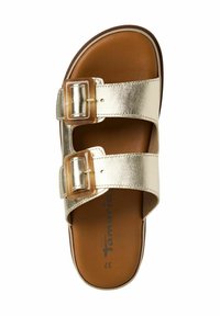 Guldmetallisk sandaler med två spännen och en brun fotbädd. Har en slät yta och platt sula. Storlek 37 anges på innersulan.