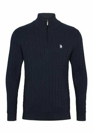 Sötétkék kötött pulóver magas gallérral, texturált kábelmintával és negyedcipzárral. Diszkrét logo a mellkasán. Puha anyag.