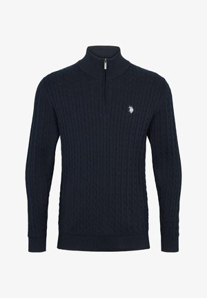 Temno modra pletena majica z visokim ovratnikom, vsebuje teksturiran pleteni vzorec in četrti zadrgo. Diskretna oznaka na prsih. Mehka material.