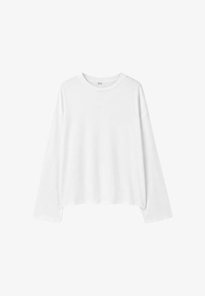 T-shirt blanc uni à manches longues avec col rond, coupe décontractée et ourlet droit, présenté sur fond blanc.