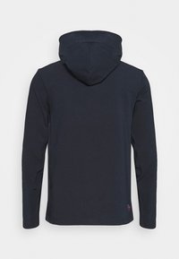 Navy blue long-sleeve hoodie made from cotton blend fabric, featuring a fitted hood and a small logo tag at the bottom.