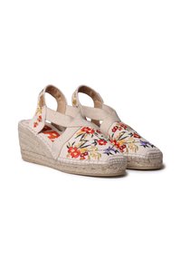 Bežové espadrilky na platforme s kvetinovou výšivkou, jutu rope podrážkou a krížovými elastickými popruhmi pre bezpečné uchytenie. Texturovaný plátno vrch.