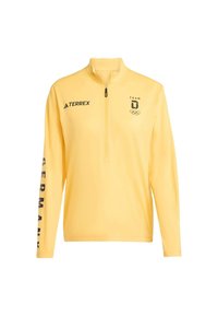 Geel pullover met lange mouwen en een kwartrits. Voorzien van een zwart Adidas-logo, "TEAM" en Olympische ringen. "DUITSLAND" in vetgedrukt op de mouw.