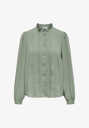 Light green blouse with long sleeves, textured fabric, pleated front, ruffled collar, and decorative buttons along the center.