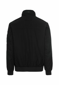 Black bomber jacket, soft fabric, ribbed cuffs and hem, zipped collar, minimalist design, featuring no visible patterns or logos.