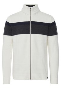 Jersey de punto con cremallera en color crema con rayas horizontales en azul marino oscuro, con cuello, puños y dobladillo acanalados, que presenta un parche con el logo en la manga.