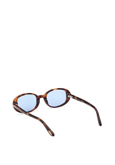 Brýle s kulatým rámem v želvovém vzoru, modrými čočkami a tenkými stranicemi. Na vnitřní straně stranic je nenápadné logo.