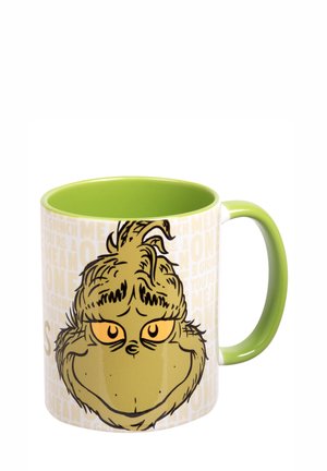Ceramic mug with a green interior and handle, featuring a Grinch illustration on a white background with repeating text in light colors.