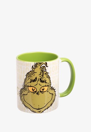 Ceramic mug with a green interior and handle, featuring a Grinch illustration on a white background with repeating text in light colors.