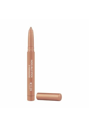 Ombretto in stick indelebile con finitura rosa oro metallizzato. Forma cilindrica con design a rotazione. Cappuccio rimosso, che rivela una punta a forma affilata.