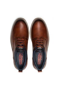 Chaussures en cuir marron avec des bouts ronds, des détails cousus et des lacets contrastants. Présentent un col rembourré et un intérieur de marque.