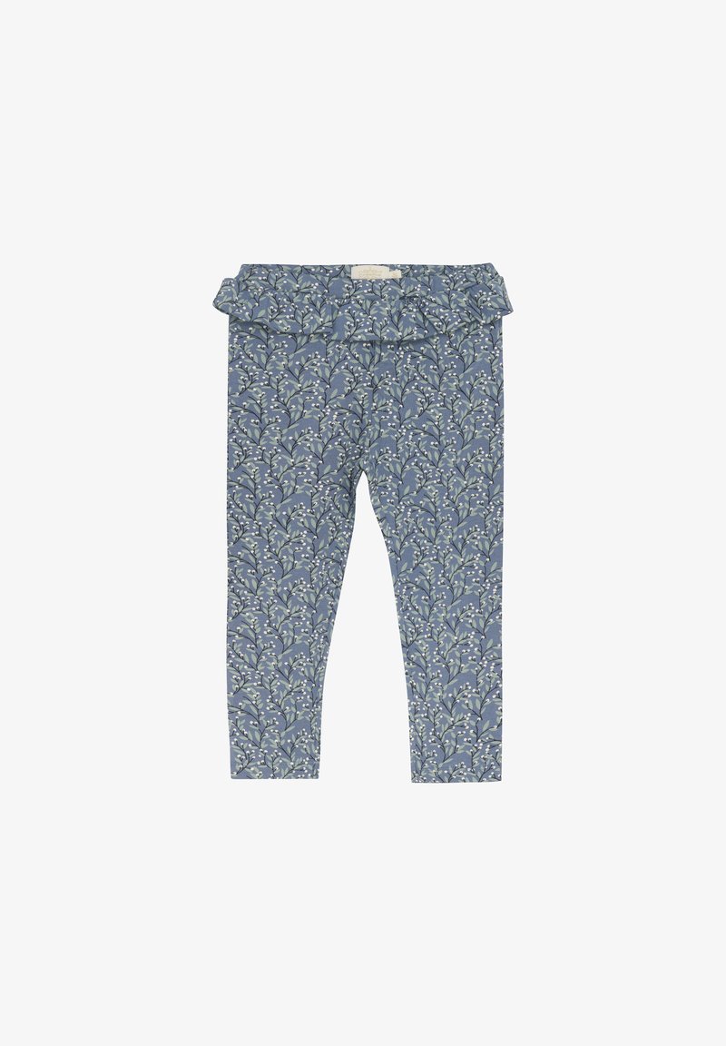 Blauwe leggings met een patroon en een gerimpelde tailleband, met een bloemdessin in wit en groen op een gestructureerde stof.