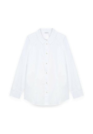 Chemise blanche à manches longues en tissu lisse, dotée d'un col classique et de boutons dorés sur le devant, avec une coupe décontractée et un ourlet arrondi.