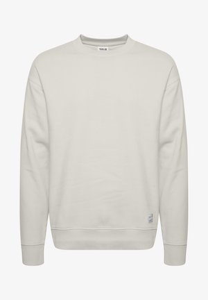Lichtbeige sweatshirt met een ronde hals, lange mouwen, geribbelde manchetten en onderrand, met een klein logotag aan de onderzijde. Gladde textuur.