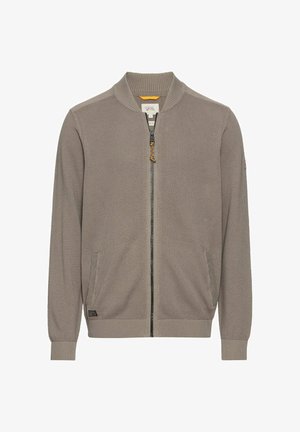 Jasnoszary rozpinany zamek, z teksturowaną powierzchnią, prążkowanymi mankietami i kołnierzem. Posiada boczne kieszenie i kontrastowy uchwyt zamka.