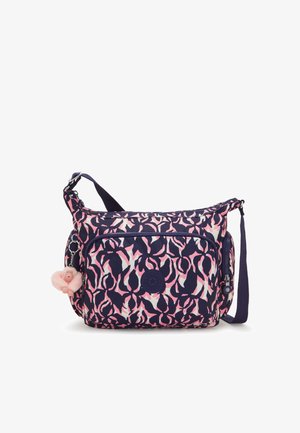 Schultertasche in Marineblau mit einem pinkfarbenen abstrakten Muster, ausgestattet mit einer Fronttasche mit Reißverschluss und einem weichen pinken Anhänger. Hergestellt aus strapazierfähigem Stoff.