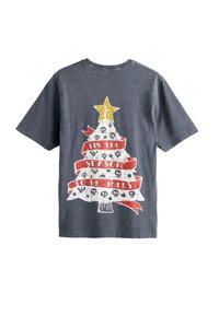 Dark gray cotton t-shirt featuring a graphic of a decorated Christmas tree with a yellow star, skulls, and red "tis the season to be jolly" ribbon.