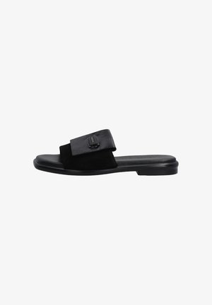 Black slide sandal featuring a mix of smooth and textured leather, wide strap with a metallic accent and a low, flexible sole.