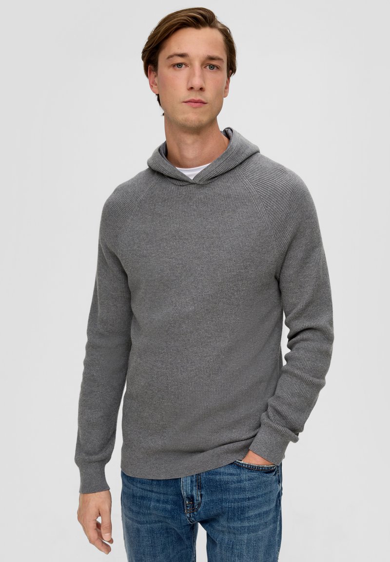 Gray knitted hoodie with a relaxed fit, featuring a hood, ribbed cuffs, and casual texture. Paired with blue jeans for a complete look.