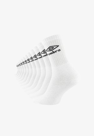 White socks made of cotton blend, featuring a ribbed texture and a black "Umbro" logo along the ankle. Eight pairs displayed in a row.