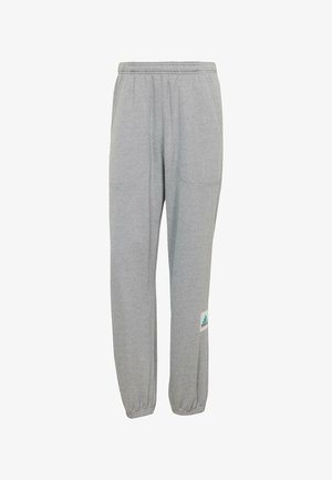 Hallhalli, mis on valmistatud pehmest kangast, kummipaelaga vöökoht, kaks küljetaskut ning sinakasroheline Adidas'i logo vasakul jalal.