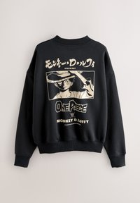 Sort sweatshirt med illustration af en figur, der holder et sværd. Indeholder tekst med "One Piece" og "Monkey D. Luffy" i cremefarve.