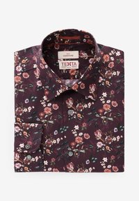 Bloemmotief shirt in donker bordeauxrood, met roze en witte bloemen. Katoenen stof, spread collar en knopenlijst met grijze knopen.