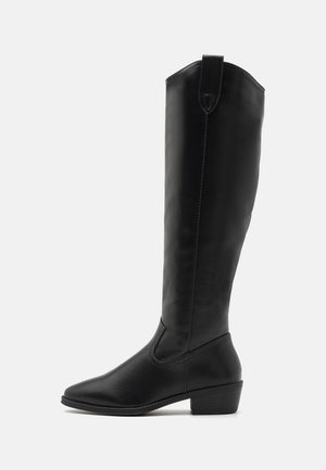 Black knee-high boots made of smooth synthetic material, featuring a rounded toe, low block heel, and side elastic panel for easy wear.