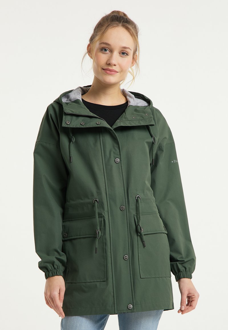Grüne wasserdichte Jacke mit einer grau gefütterten Kapuze, Kordelzug in der Taille, Druckknöpfen und zwei Vordertaschen mit elastischen Bündchen.