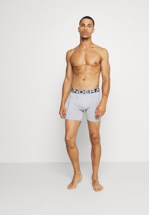 Grau Boxer-Shorts mit einem schwarzen "UNDER ARMOUR"-Bund, enganliegend, aus weichem Material, mit einem Fronttaschendesign für zusätzlichen Komfort.
