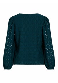 Cyan blouse met een textuur van geometrische patronen, met pofmouwen en een brede ronde halslijn. De stof heeft een lichte, luchtige kwaliteit.