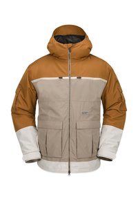 Isolerad jacka med brun huva och övre del, beige kropp och vita nedre ärmar. Har två framfickor och dragkedja.