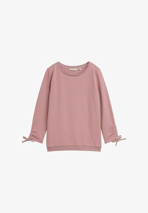 Top de manga larga de color rosa claro con un patrón texturizado, escote redondo y lazos en las mangas. Tejido suave con un ajuste relajado.