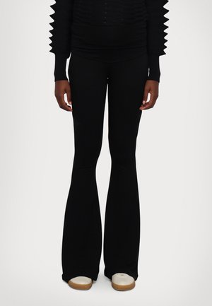 STIEG FLARED - Leggings - black