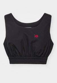 Svart cropped tank topp med scoop-halsutskärning, rynkad midja och en liten röd och svart DKNY-logga på framsidan. Slen tekstur.