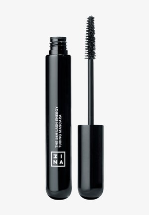 Tube noir et baguette de mascara avec le texte « THE 24H LASH ENERGY TUBING MASCARA » sur le tube, baguette montrant des poils denses pour l'application sur les cils.