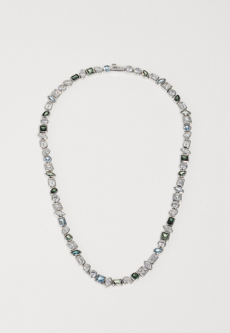 Necklace featuring varied-shaped gemstones in blue, green, and clear, set in silver-tone metal. Smooth, polished finish with alternating shapes.