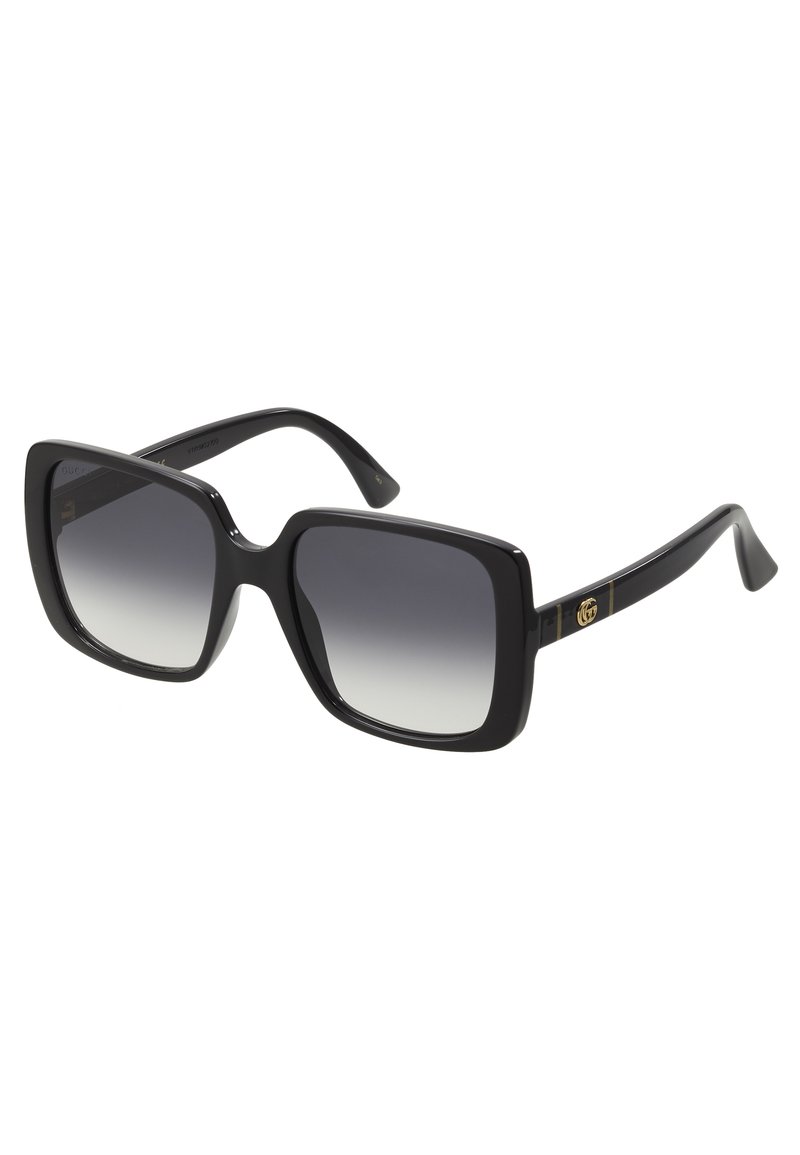 Black square sunglasses with gradient lenses, glossy plastic frame, and gold logo accents on the temples. Sleek design and sturdy arms.
