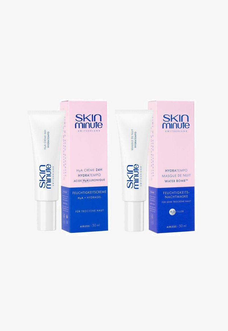 Deux tubes blancs avec des bouchons argentés, étiquetés comme produits de soins de la peau. Accompagnés de boîtes pastel roses et bleues. Chacun contient 50 ml.