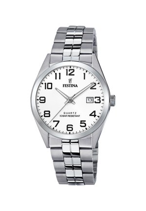 Montre en acier inoxydable argenté avec un bracelet poli, un cadran blanc, des index noirs et un affichage de la date à trois heures. Mouvement quartz.