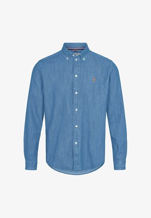 Gaiši zila džinsa krekls ar pogu aizdares apkakli, garām piedurknēm un izliektu apakšu. Krūšu rajonā ir neliels izšūts logotips.