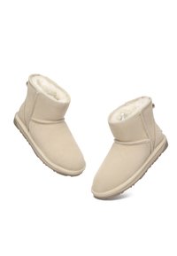 Beige ankle boots made of soft suede with a plush interior lining, stitched detailing, and a lightweight rubber sole for grip.