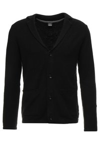 Musta neuletakki, jossa on huivikaulus, etutaskut ja kuusi nappia. Valmistettu pehmeästä kankaasta, jossa on teksturoitu viimeistely ja pitkät hihat.