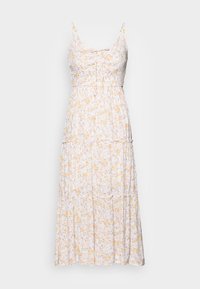 Vestido maxi floral con tirantes finos, cuerpo ajustado y dobladillo con volantes en capas. Fondo blanco con pequeñas flores amarillas y rosas. Tela suave.