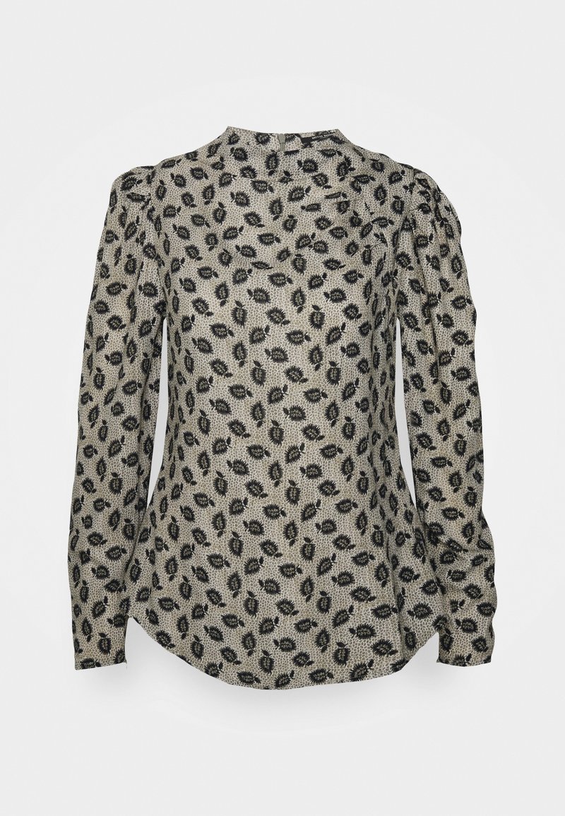 Blouse beige à manches longues avec motif de feuilles noires, épaules froncées et col montant avec fermeture par bouton en œillet au dos.